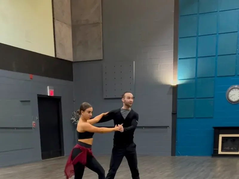 Couple practicing a cha cha figure in an intermediate Ottawa dance class at DQ Ballroom & Fitness