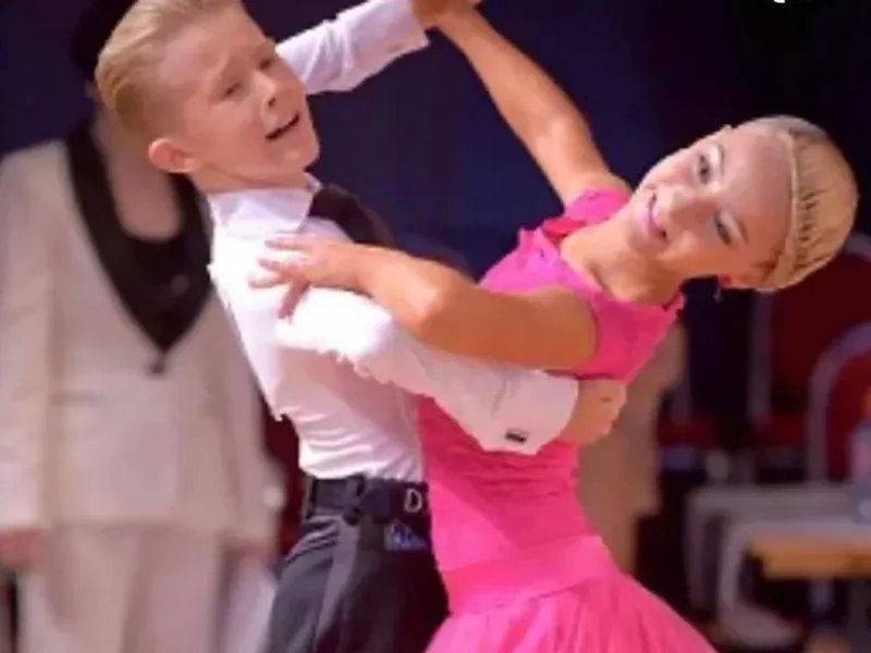 Boy and girl in a closed hold performing at an event in an intermediate kids dance class in Ottawa