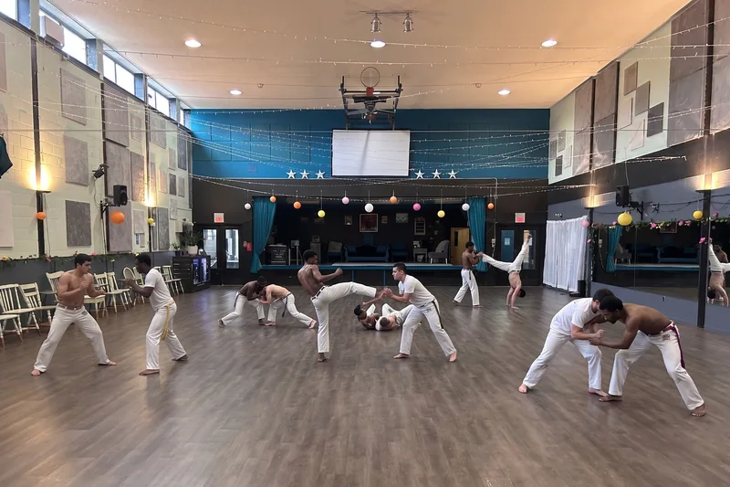 Capoeira group training in the big ballroom offered for martial arts studio rentals in Ottawa at DQ Ballroom & Fitness