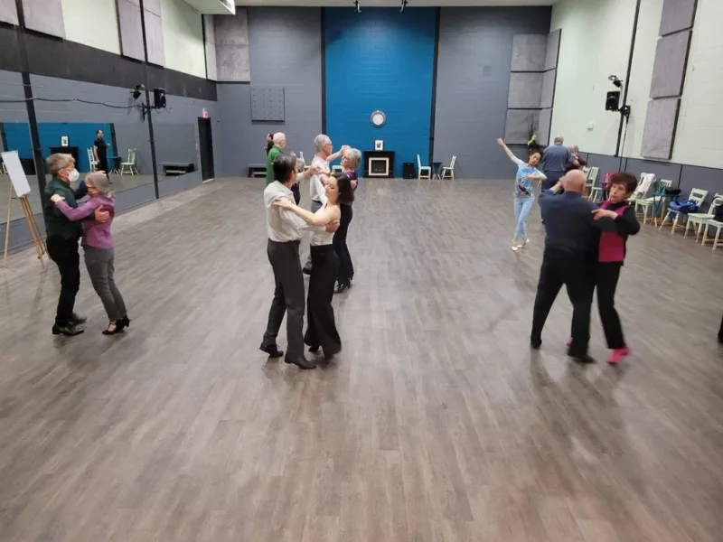 Beginner couples practicing partner holds in a salsa and Argentine tango class in Ottawa at DQ Ballroom & Fitness