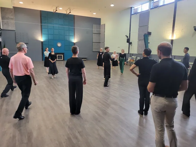 Beginner students gathered on the floor during a waltz dance class in Ottawa at DQ Ballroom & Fitness